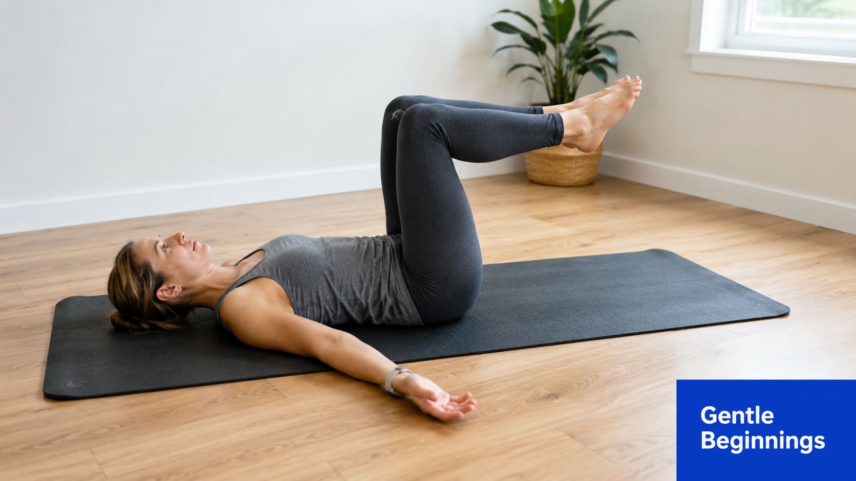 A woman lying on a yoga mat in a tabletop position for a core stability exercise.