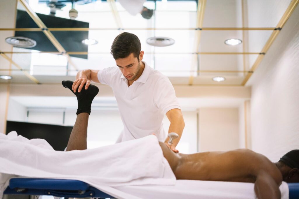 Osteopath treating lower back pain patient at Bayside Osteopathic Health clinic