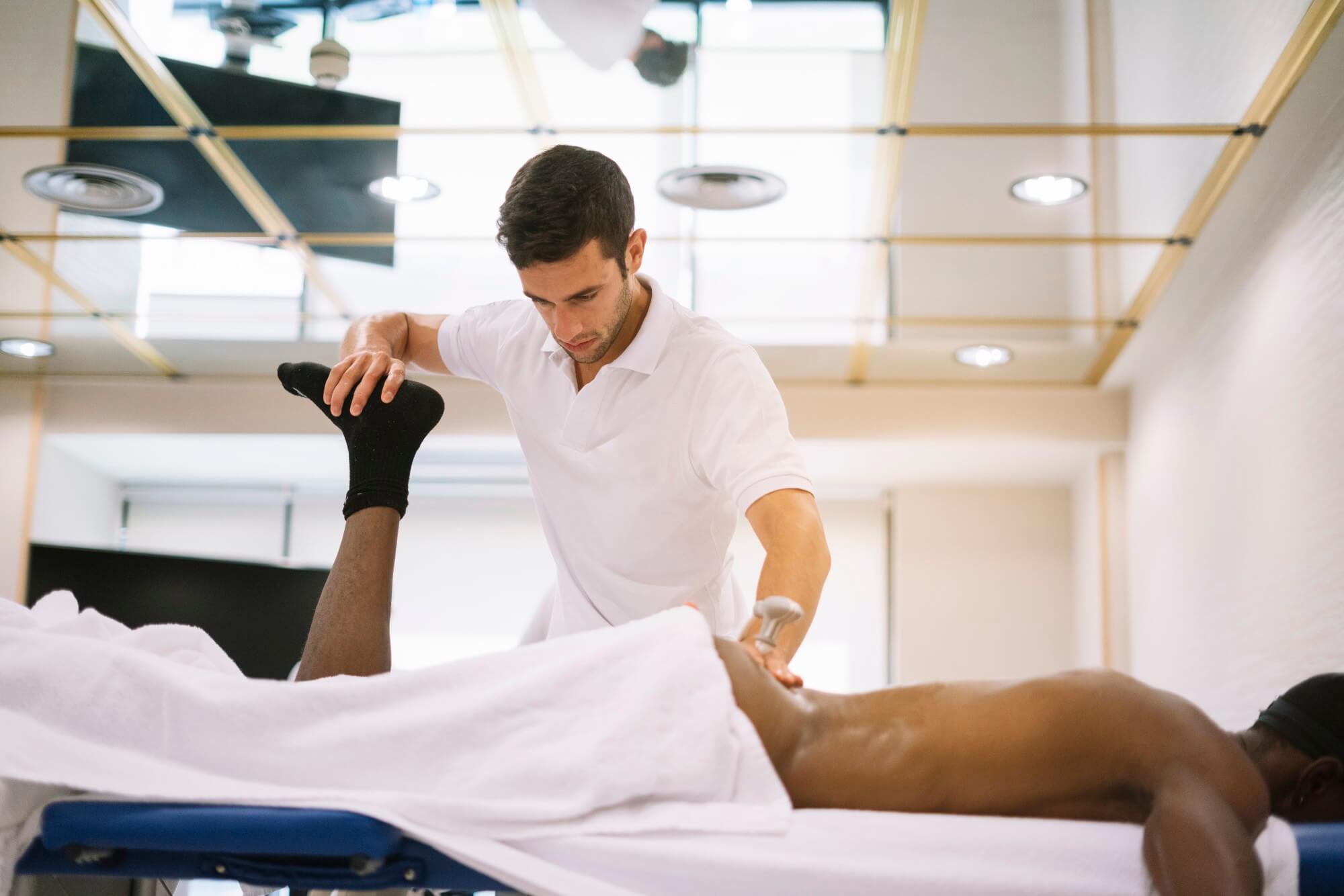 Osteopath treating lower back pain patient at Bayside Osteopathic Health clinic
